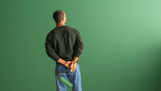 Man watching Lick Green 07 paint dry
