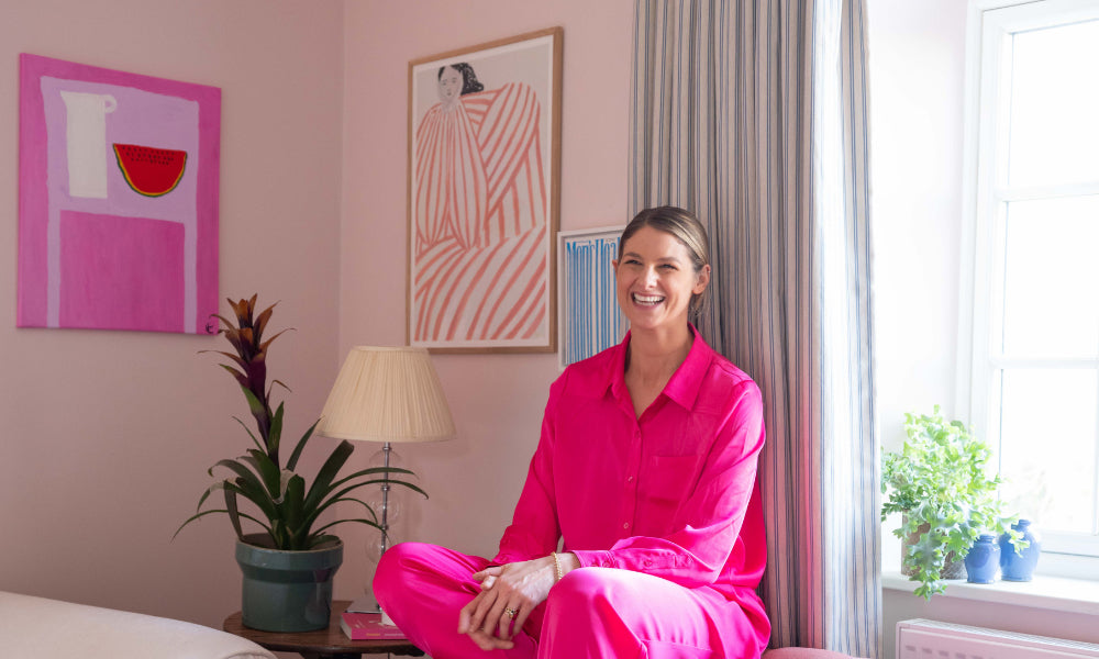 Tash Bradley in living room painted in Lick Pink 01 paint