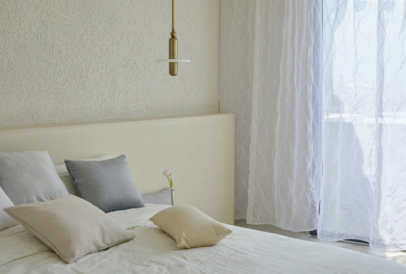 Minimalist bedroom with linen curtains